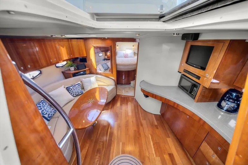 Slide: The Image of Luxurious interior of 2010 Regal Commodore 4460 yacht with wood finishes and modern amenities. - 26