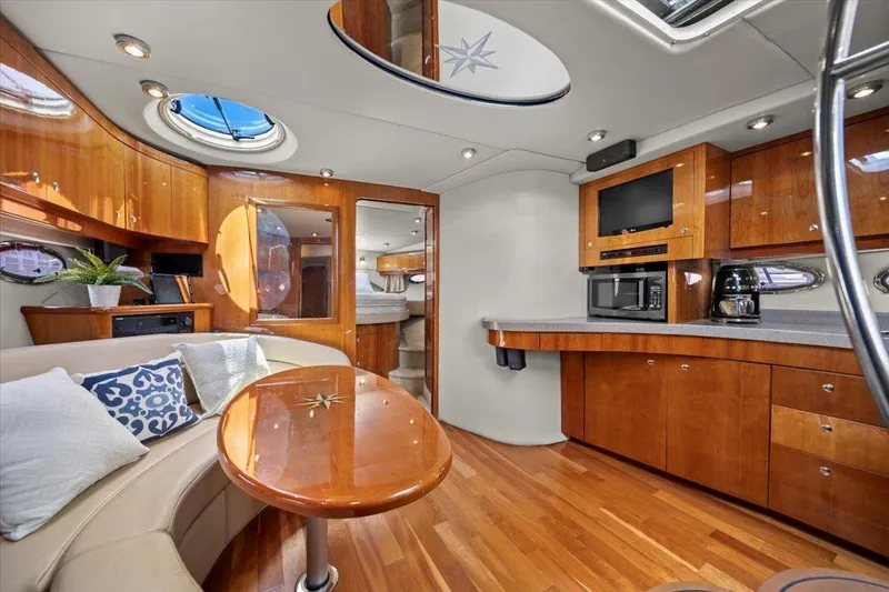 Slide: The Image of Luxurious interior of 2010 Regal Commodore 4460 yacht with modern kitchen and seating area. - 28