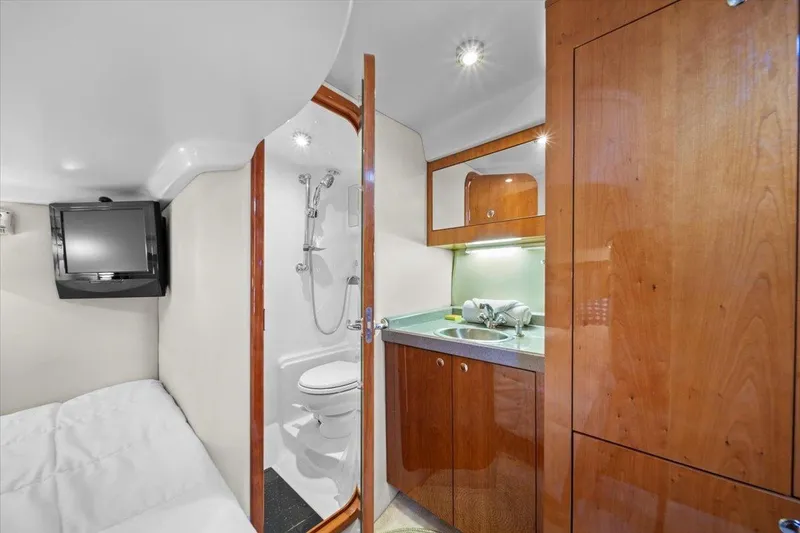 Slide: The Image of Interior of 2010 Regal Commodore 4460 yacht with bathroom and kitchenette. - 33