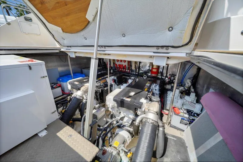 Slide: The Image of Engine compartment of 2010 Regal Commodore 4460 boat, showcasing mechanical components and systems. - 37