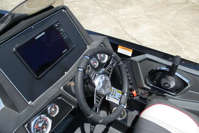 Slide: The Image of 2019 Ranger Z519L boat dashboard with steering wheel and Lowrance HDS display. - 4