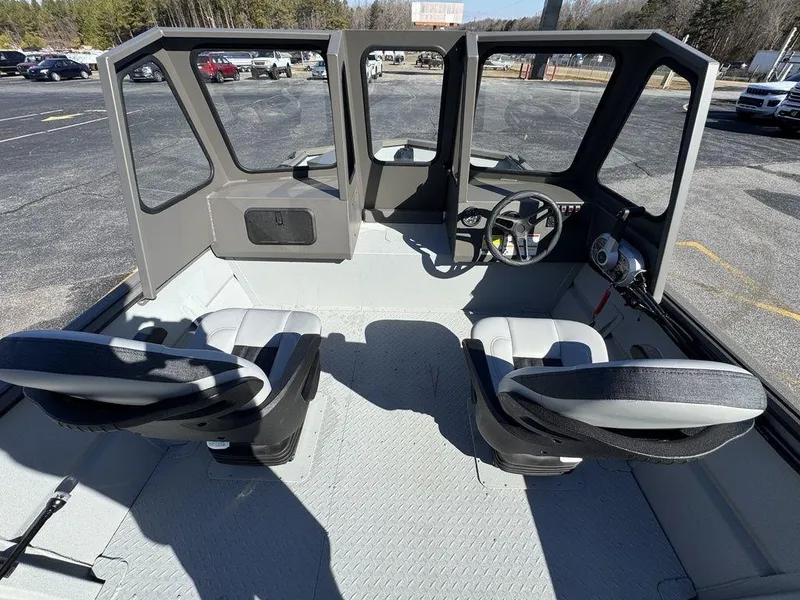 Slide: The Image of Interior of 2025 SeaArk 2072 MV Flat Cat boat with dual seats and steering console. - 13