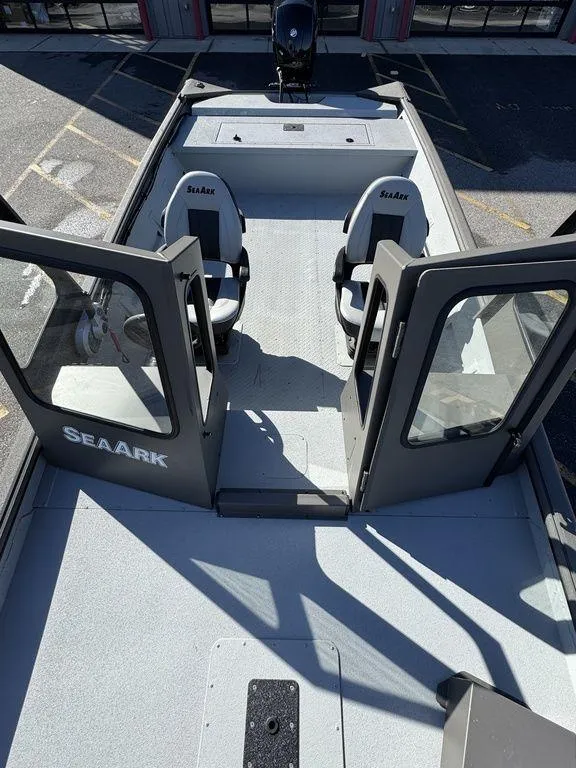 Slide: The Image of 2025 SeaArk 2072 MV Flat Cat boat with open doors and seating. - 16