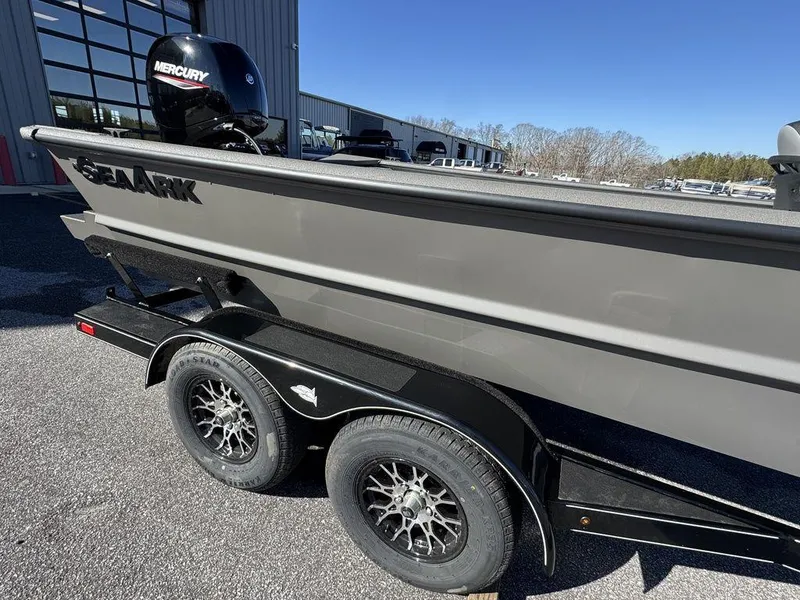 Slide: The Image of 2025 SeaArk 2072 MV Flat Cat boat on trailer, featuring Mercury engine. - 3