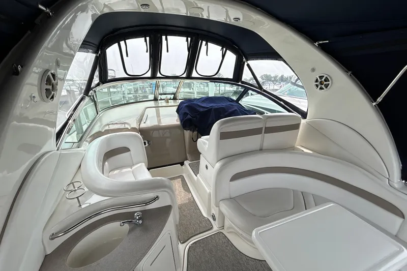 Slide: The Image of Interior of 2005 Sea Ray 320 Sundancer yacht with elegant seating and helm. - 11