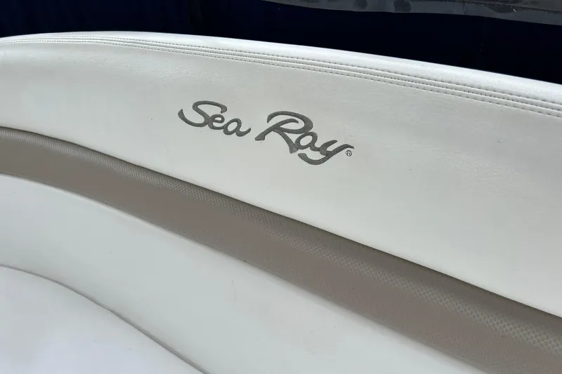 Slide: The Image of White leather seat with Sea Ray logo on a 2005 Sea Ray 320 Sundancer boat. - 15