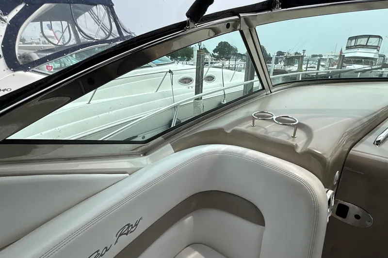 Slide: The Image of Interior view of a 2005 Sea Ray 320 Sundancer boat at a marina. - 23