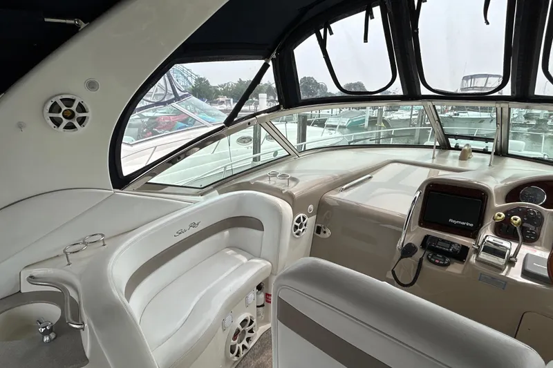 Slide: The Image of Interior view of 2005 Sea Ray 320 Sundancer boat cockpit with navigation equipment. - 26