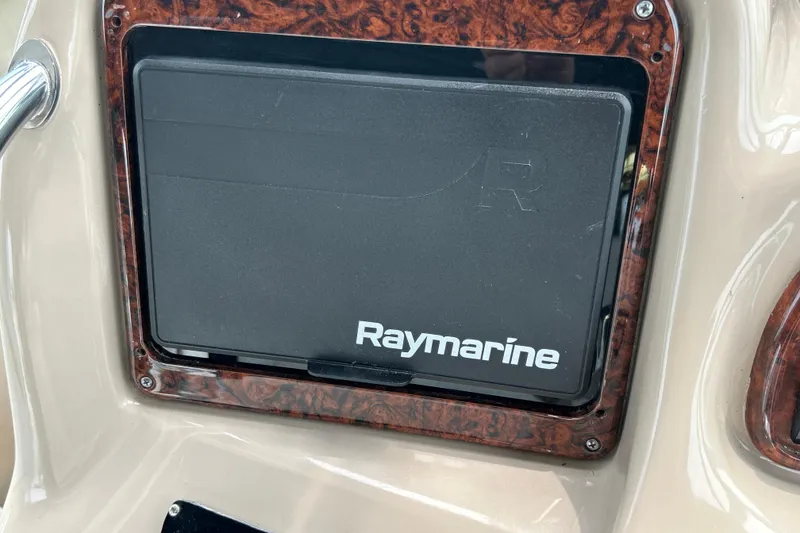 Slide: The Image of Raymarine navigation system on 2005 Sea Ray 320 Sundancer boat dashboard. - 35