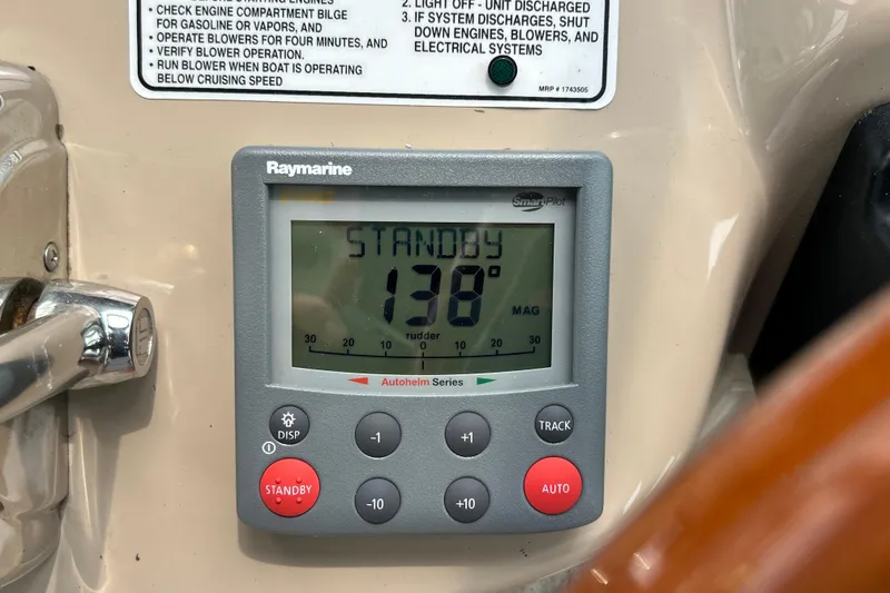 Slide: The Image of Raymarine autopilot display on 2005 Sea Ray 320 Sundancer boat dashboard. - 36