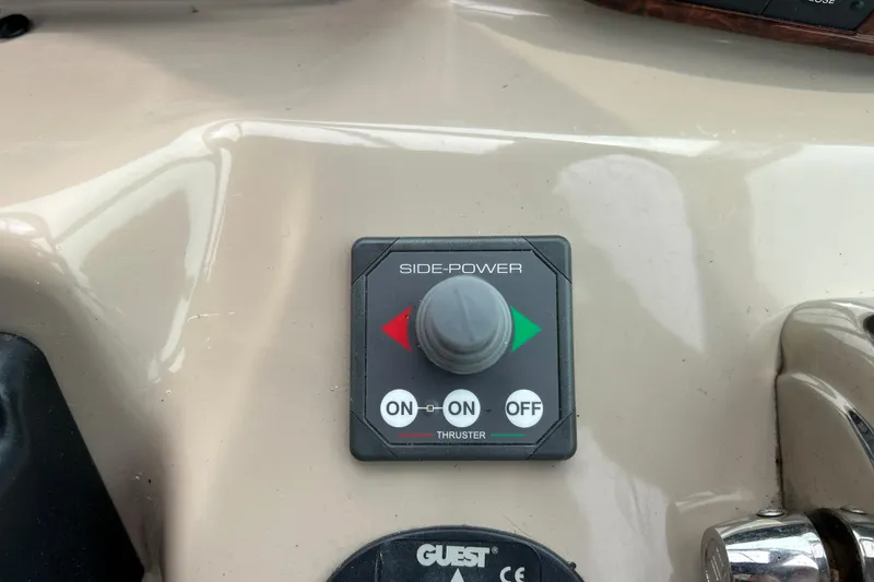 Slide: The Image of Side-Power thruster control on 2005 Sea Ray 320 Sundancer boat dashboard. - 37