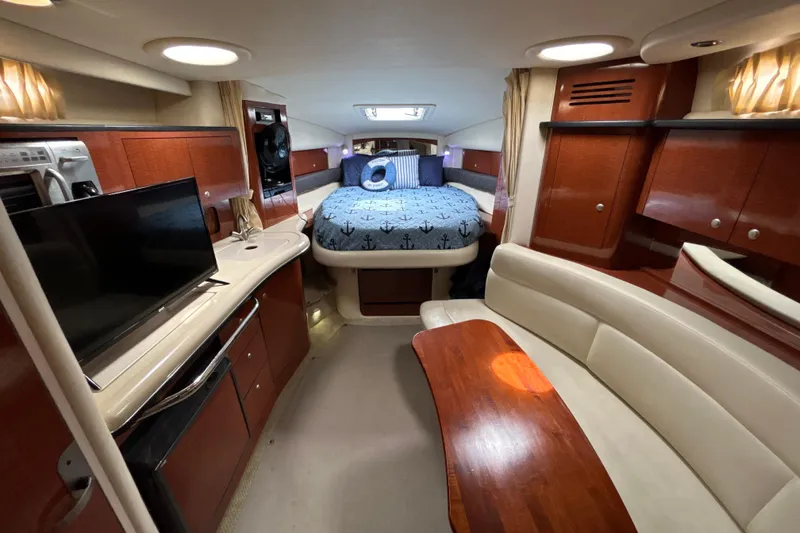 Slide: The Image of Luxurious interior of 2005 Sea Ray 320 Sundancer yacht with cozy seating and modern amenities. - 44