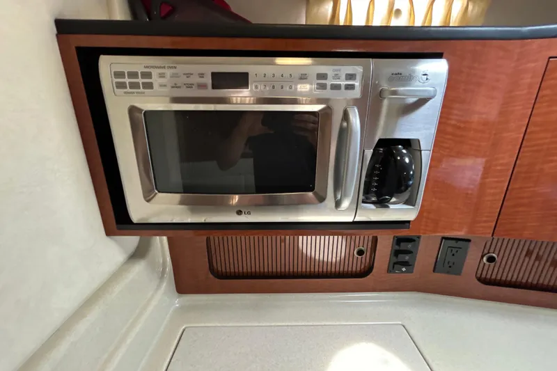 Slide: The Image of LG microwave and coffee maker in 2005 Sea Ray 320 Sundancer yacht kitchen. - 45