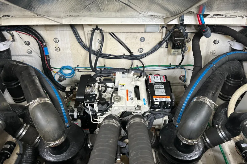 Slide: The Image of Engine compartment of a 2005 Sea Ray 320 Sundancer with Kohler generator and wiring. - 63