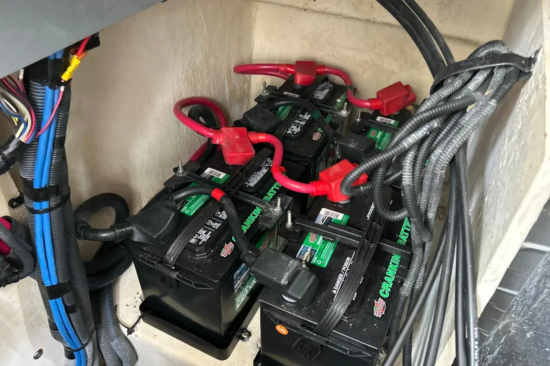 Slide: The Image of Batteries and wiring in a 2005 Sea Ray 320 Sundancer boat. - 68