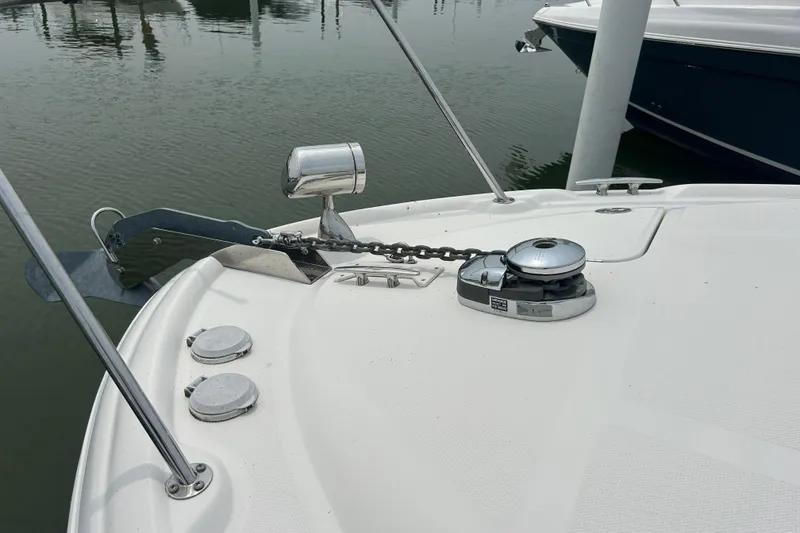 Slide: The Image of 2005 Sea Ray 320 Sundancer boat anchor and winch system at dock. - 7
