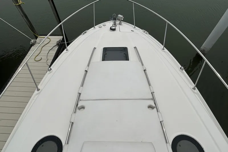 Slide: The Image of 2005 Sea Ray 320 Sundancer boat deck, docked at marina. - 8