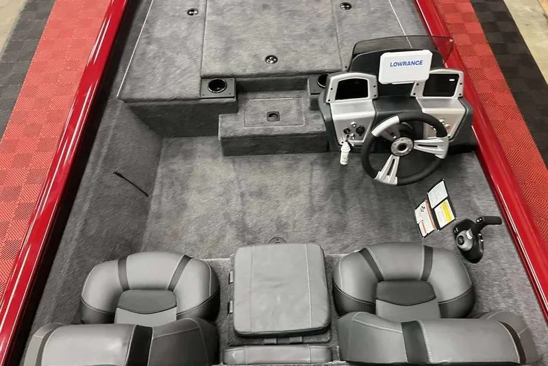 Slide: The Image of 2026 Tracker Pro Team™ 190 boat interior with steering wheel and seating. - 5