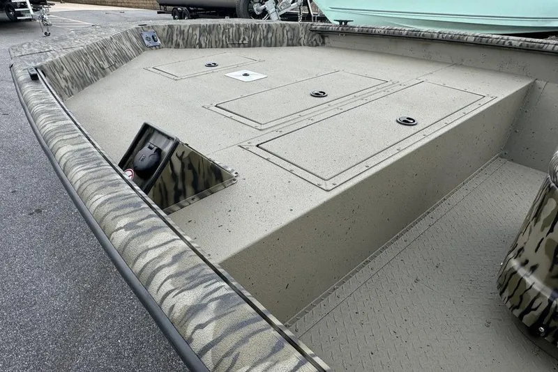 Slide: The Image of 2026 SeaArk Shadow 20 Elite CC boat with camouflage design and spacious deck. - 16