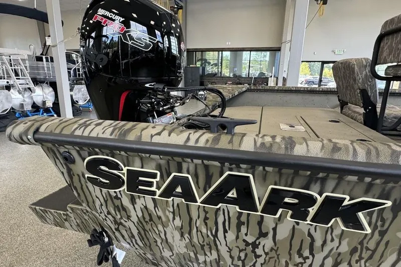 Slide: The Image of 2026 SeaArk Shadow 20 Elite CC boat with camouflage design and Mercury Pro XS engine. - 17