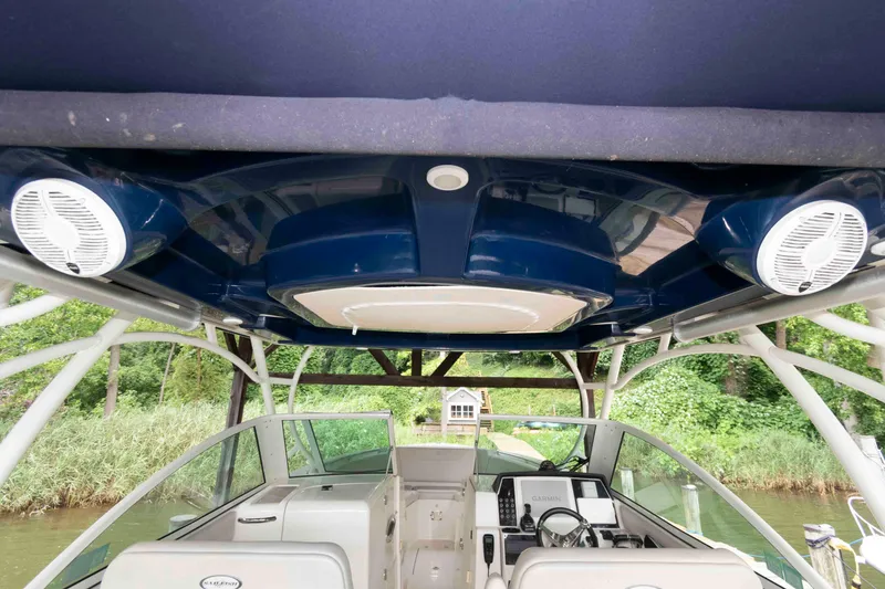 Slide: The Image of 2020 Sailfish 325 DC boat interior with speakers and navigation equipment. - 22