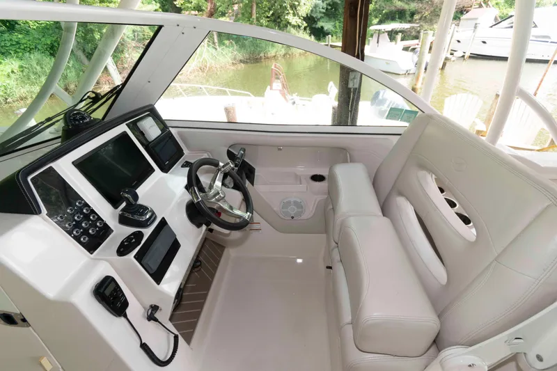 Slide: The Image of Interior of 2020 Sailfish 325 DC boat with modern helm and seating. - 7
