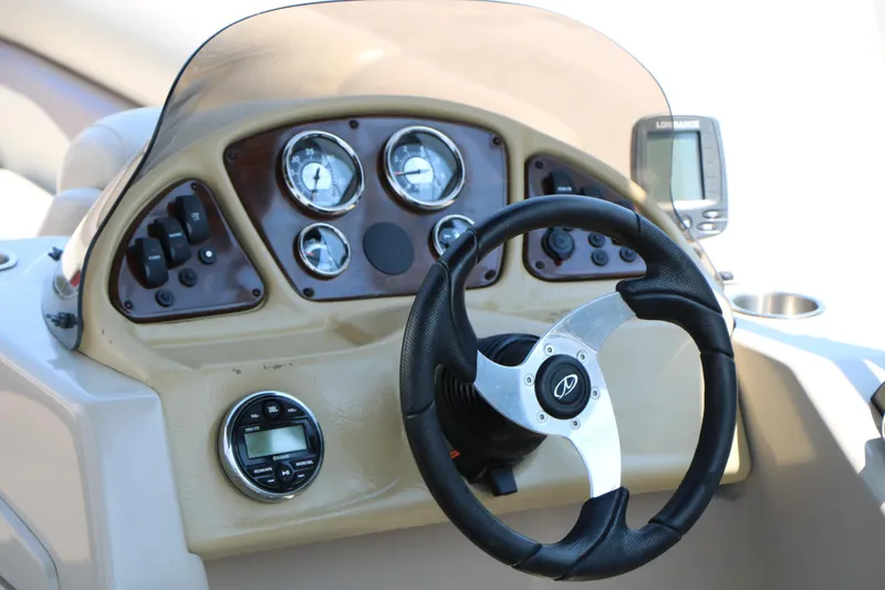 Slide: The Image of Dashboard of 2014 Veranda Relax V2275 boat with steering wheel and gauges. - 18