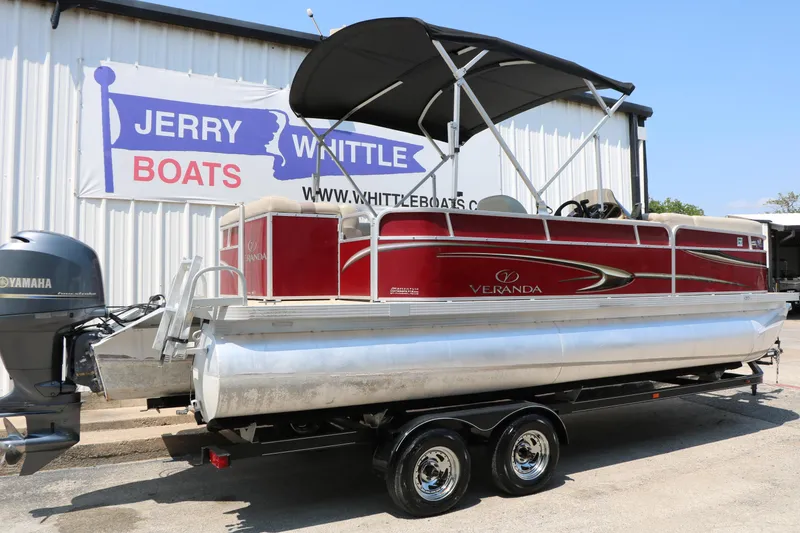 Slide: The Image of 2014 Veranda Relax V2275 pontoon boat on trailer at Jerry Whittle Boats dealership. - 2