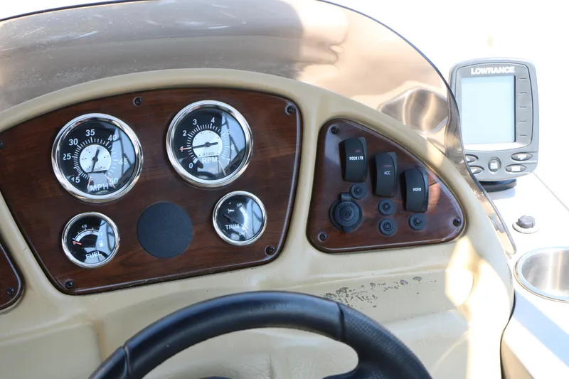 Slide: The Image of Dashboard of 2014 Veranda Relax V2275 boat with gauges and controls. - 22