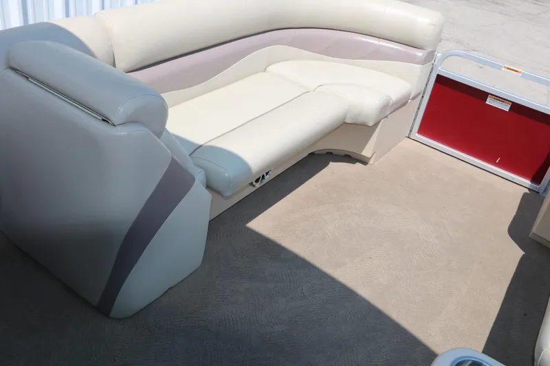 Slide: The Image of 2014 Veranda Relax V2275 boat interior with beige seating and red panel. - 23