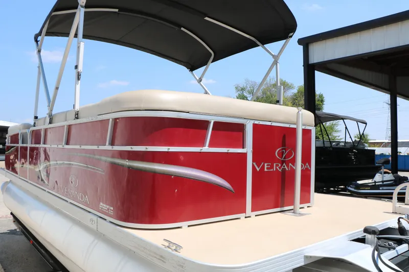 Slide: The Image of 2014 Veranda Relax V2275 pontoon boat with red exterior and canopy. - 8