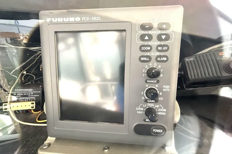 Slide: The Image of Furuno FCV-582L fish finder on 1987 Davidson 48 Sportfish boat dashboard. - 28