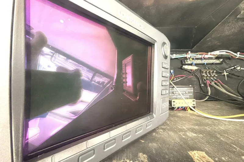 Slide: The Image of Lowrance marine electronics on 1987 Davidson 48 Sportfish boat, showing interior wiring setup. - 29