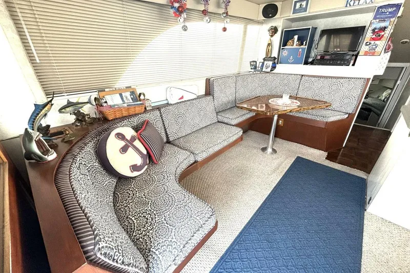 Slide: The Image of Interior of 1987 Davidson 48 Sportfish with patterned seating and nautical decor. - 34