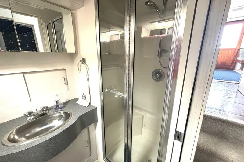 Slide: The Image of Bathroom interior of 1987 Davidson 48 Sportfish yacht with shower and sink. - 46