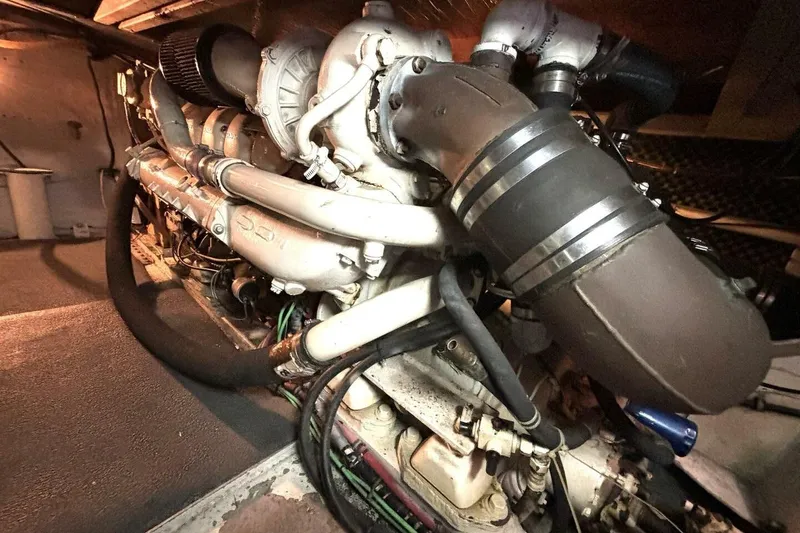 Slide: The Image of Engine room of 1987 Davidson 48 Sportfish, showcasing complex machinery and components. - 53