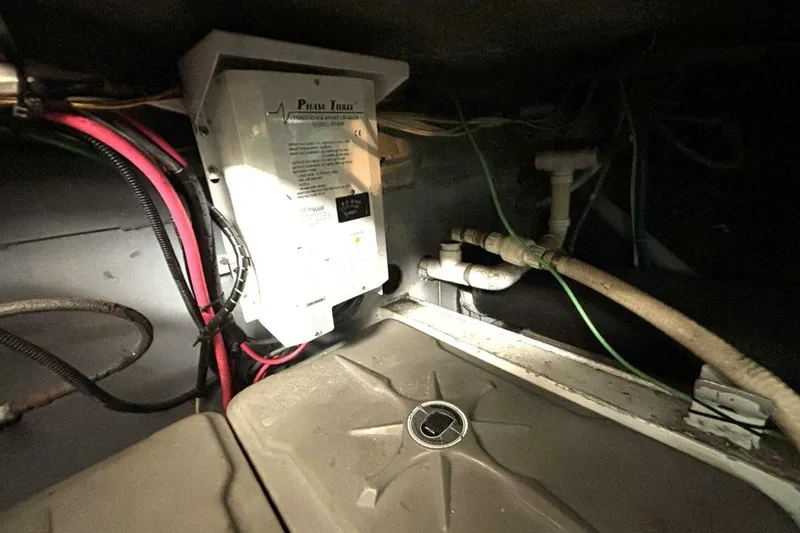 Slide: The Image of Electrical system inside 1987 Davidson 48 Sportfish boat, featuring wiring and components. - 54