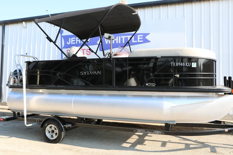 Slide: The Image of 2023 Sylvan Mirage Fish 820 Party Fish pontoon boat on trailer. - 1