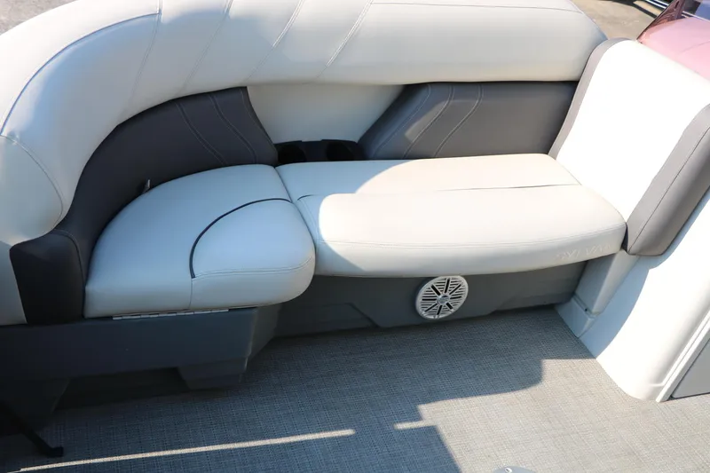 Slide: The Image of 2023 Sylvan Mirage Fish 820 Party Fish boat seating with speaker, featuring gray and white upholstery. - 15