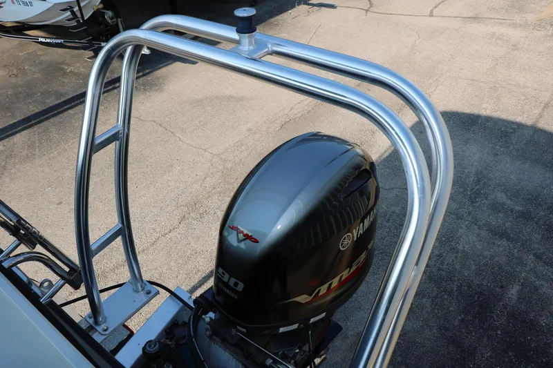 Slide: The Image of 2023 Sylvan Mirage Fish 820 with Yamaha outboard motor and stainless steel ladder. - 16