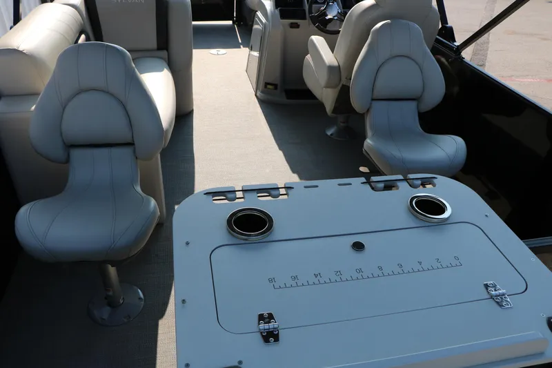 Slide: The Image of 2023 Sylvan Mirage Fish 820 Party Fish interior with seating and fishing table. - 18