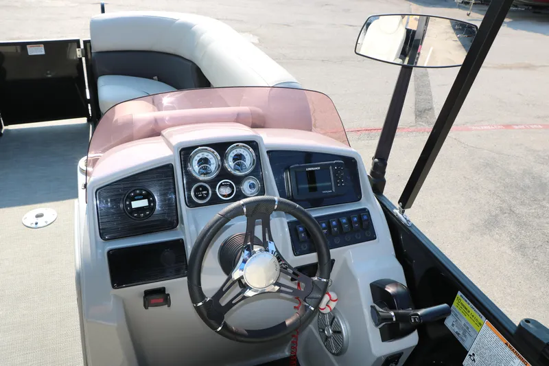 Slide: The Image of 2023 Sylvan Mirage Fish 820 Party Fish boat dashboard with steering wheel and controls. - 20