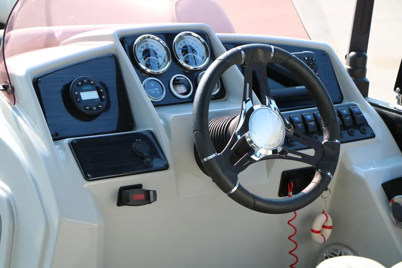 Slide: The Image of Dashboard of 2023 Sylvan Mirage Fish 820 Party Fish boat with steering wheel and gauges. - 26