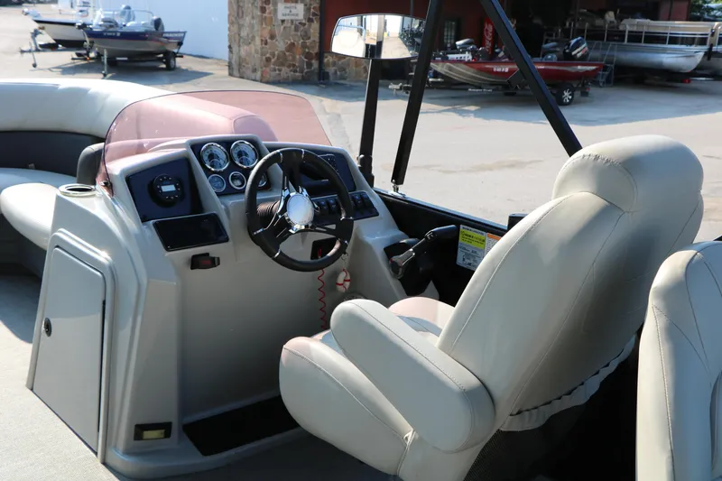 Slide: The Image of 2023 Sylvan Mirage Fish 820 Party Fish boat interior with steering console and seating. - 27