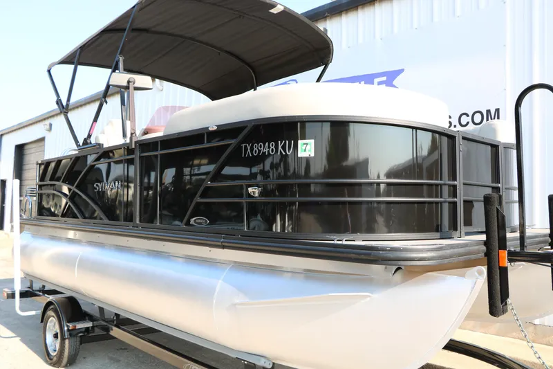 Slide: The Image of 2023 Sylvan Mirage Fish 820 Party Fish pontoon boat on trailer, side view. - 4