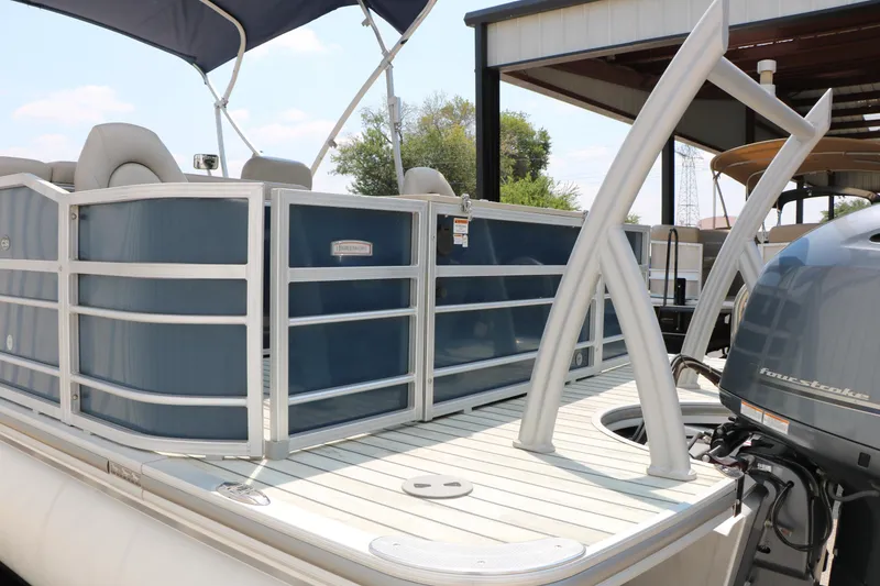 Slide: The Image of 2017 Trifecta 21 F Sts pontoon boat with blue panels and four-stroke engine. - 12