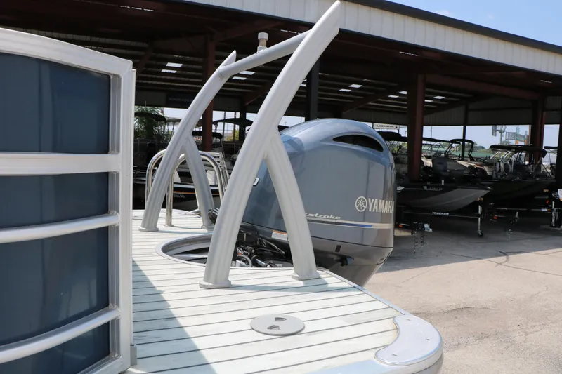 Slide: The Image of 2017 Trifecta 21 F Sts pontoon boat with Yamaha outboard motor in a marina. - 13