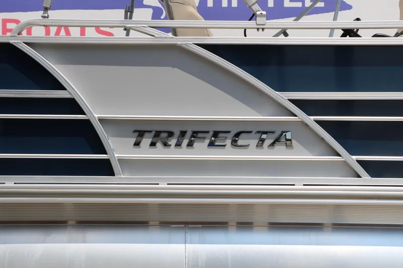 Slide: The Image of 2017 Trifecta 21 F Sts boat with sleek design and metallic logo. - 17