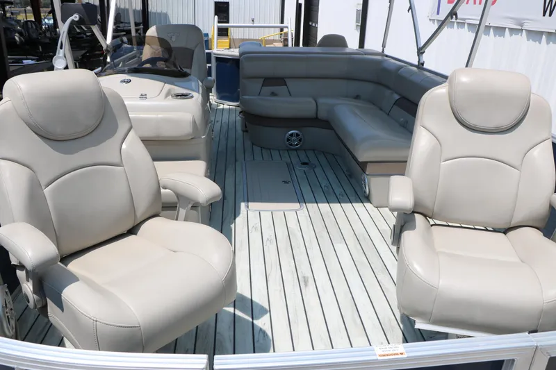 Slide: The Image of 2017 Trifecta 21 F Sts pontoon boat with beige seating and spacious deck layout. - 19
