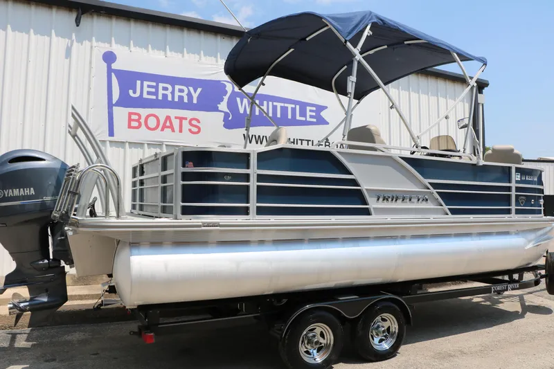 Slide: The Image of 2017 Trifecta 21 F Sts pontoon boat with Yamaha motor at dealership. - 2